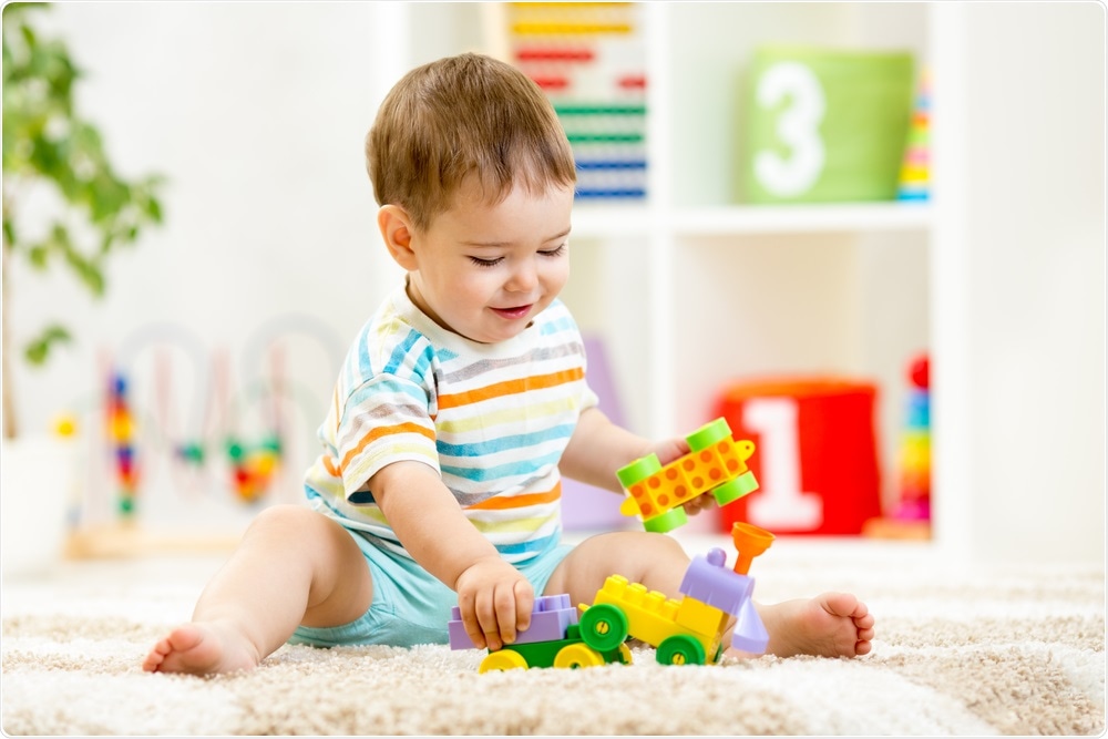 Baby boy playing with his toys - the new gene therapy will allow children to grow up and explore the world.