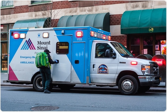 NEW YORK - APRIL 01, 2020: An EMS worker outside of a Mount Sinai ambulance in Tribeca, New York City during the COVID-19 pandemic. Image Credit: Jennifer M. Mason / Shutterstock