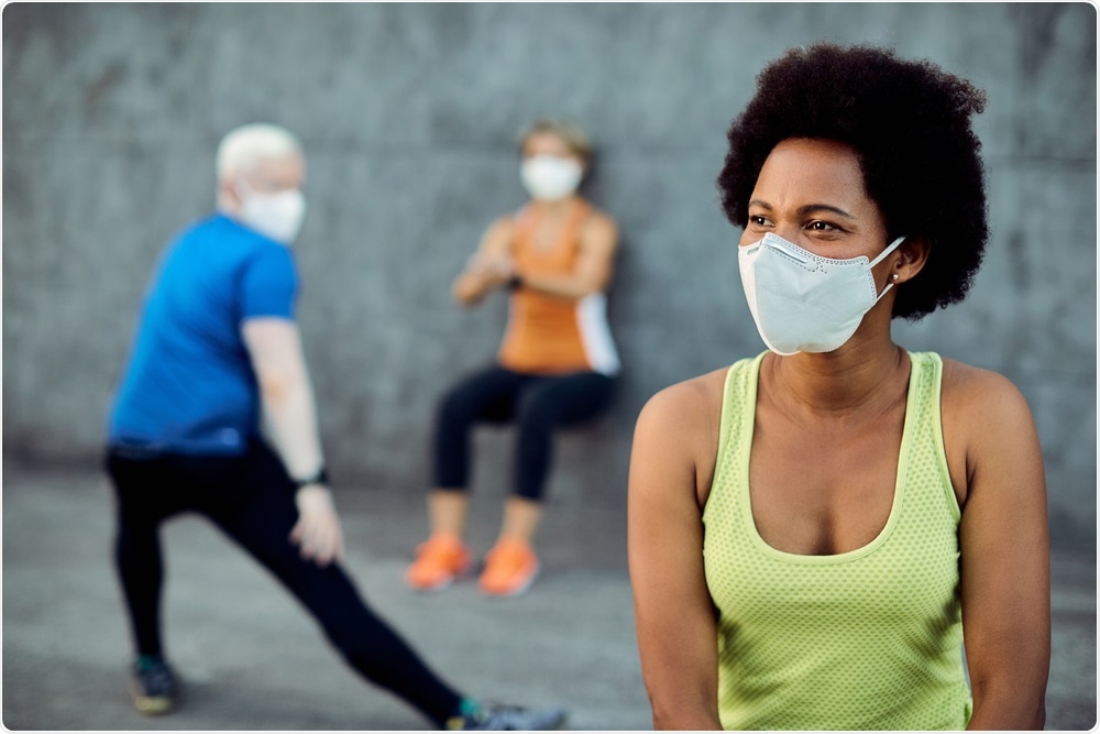 People wearing face masks while exercising