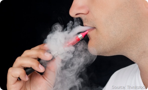 Young man smoking E-cigarette