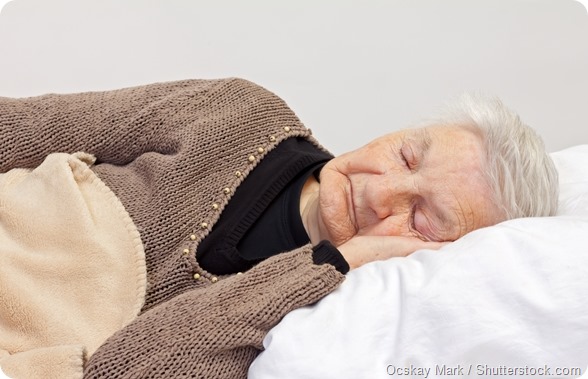 Elderly woman sleeping in bed
