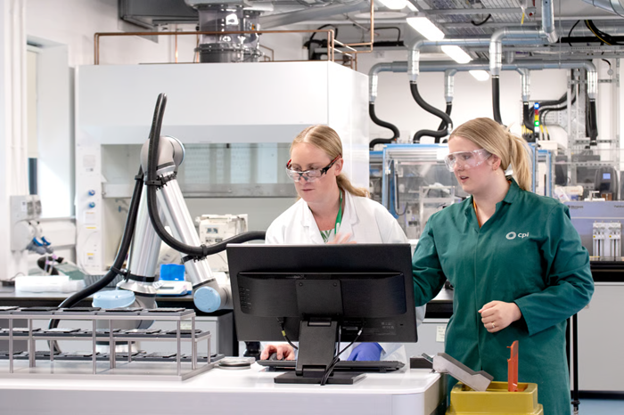 Lynn Dobson and a colleague analyzing results on a PC.
