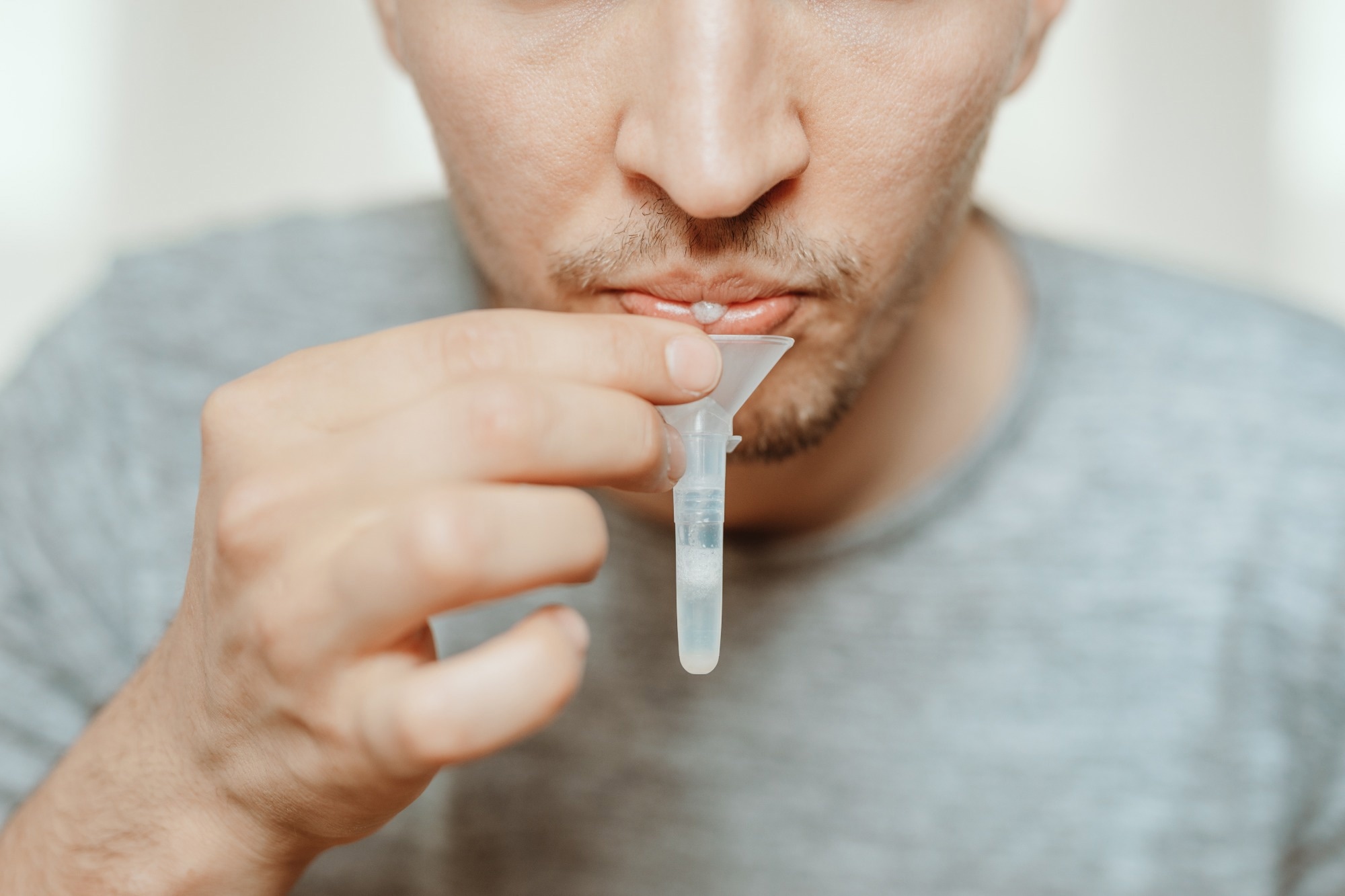 Study: Persistence of SARS-CoV-2 in saliva: Implications for late-stage diagnosis and infectious duration. Image Credit: Shotmedia / Shutterstock