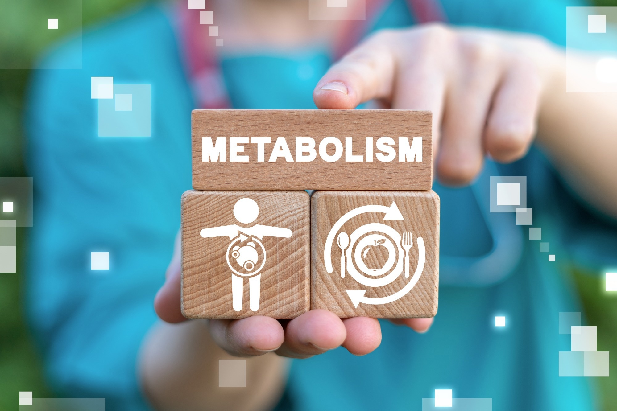 Woman holding blocks representing metabolism