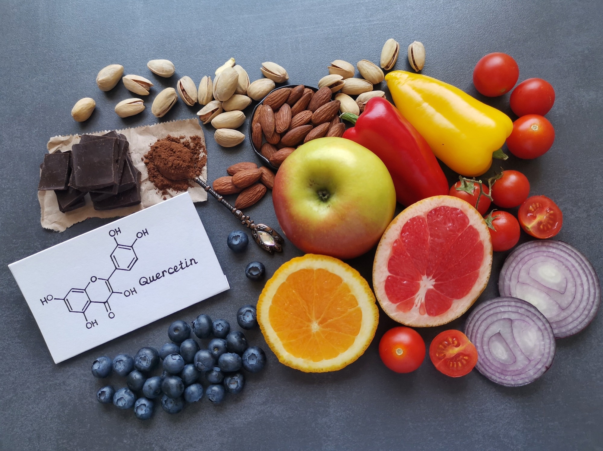 Structural chemical formula of quercetin with fresh fruit and vegetable.