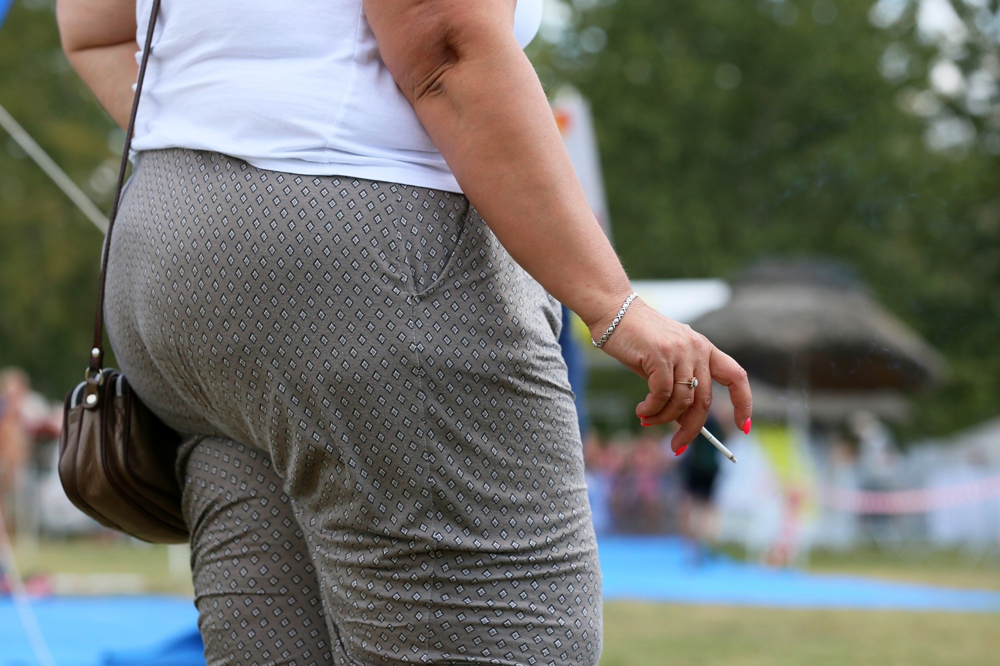 Fat woman smoking a cigarette