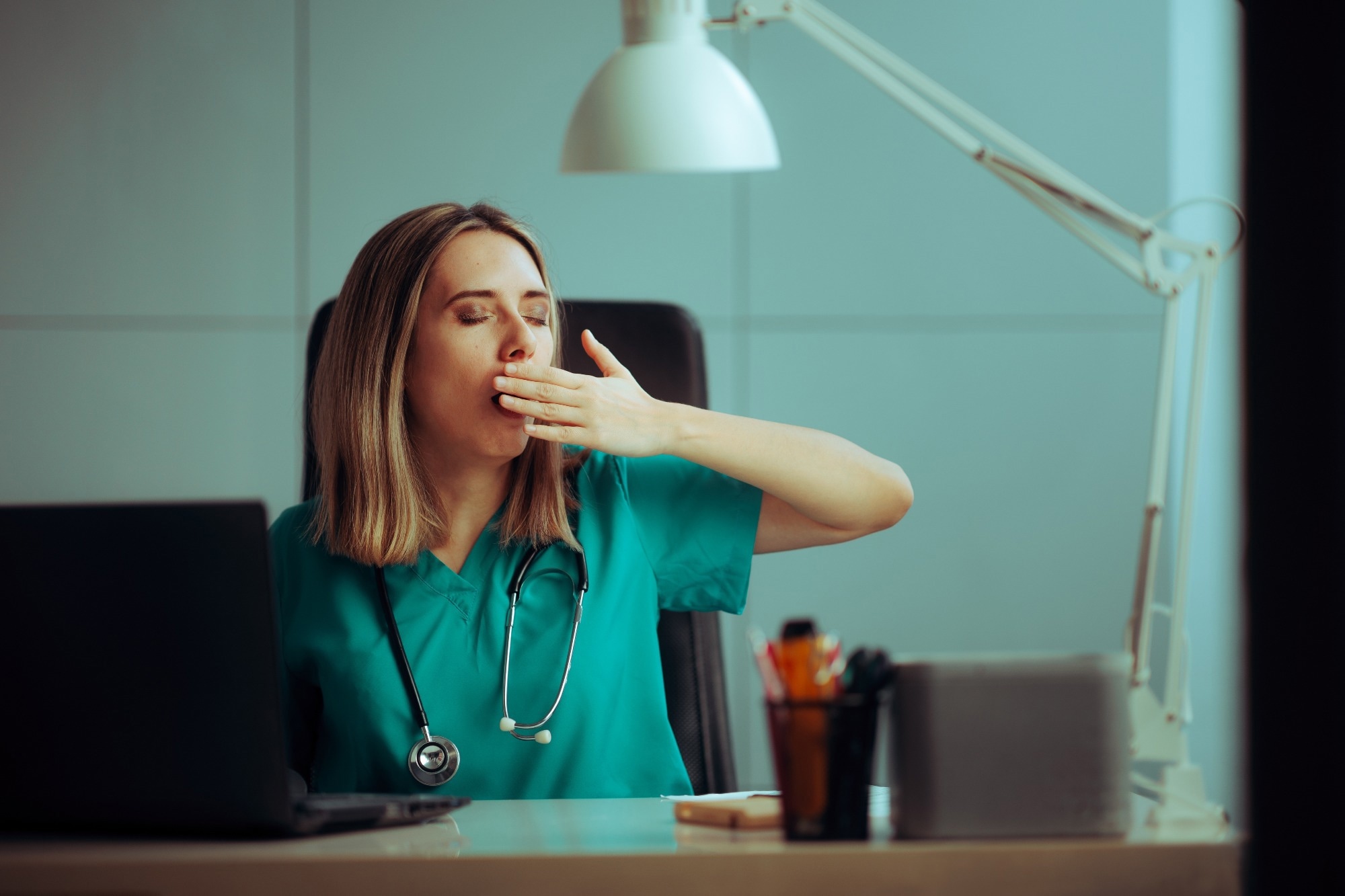 Sleepy medical practitioner working in a night shift