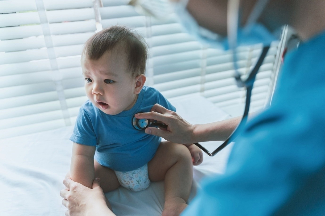 Doctors with baby patient